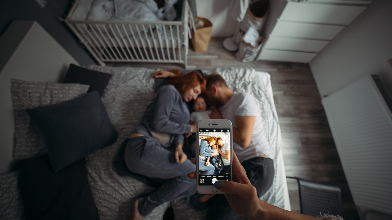 Infant Optics DXR-8 handheld monitor compared with a high-resolution smartphone display